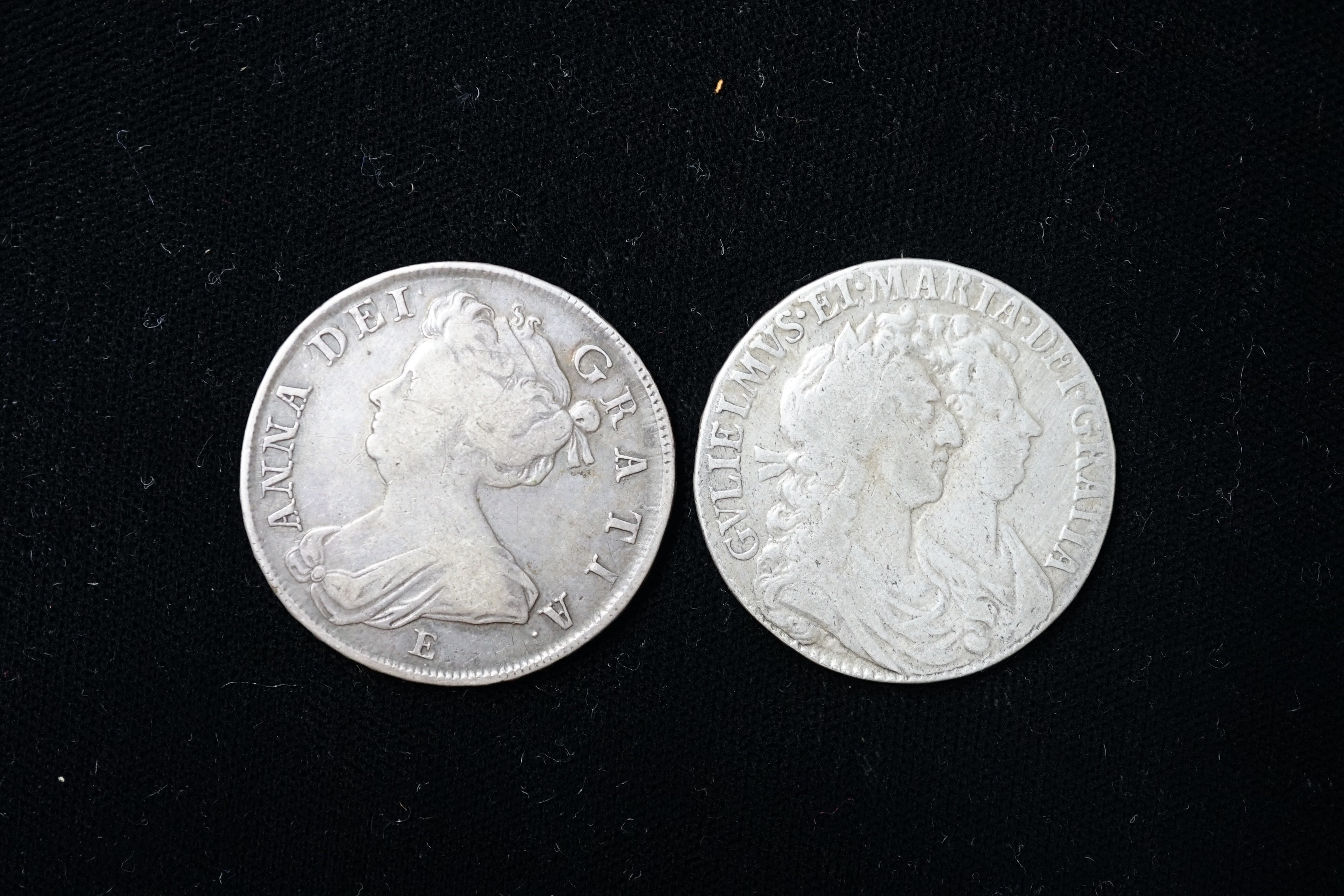 A Queen Anne silver halfcrown, 1707 E, SEXTO edge, about Fine and a William & Mary silver halfcrown 1689, about Fine or better